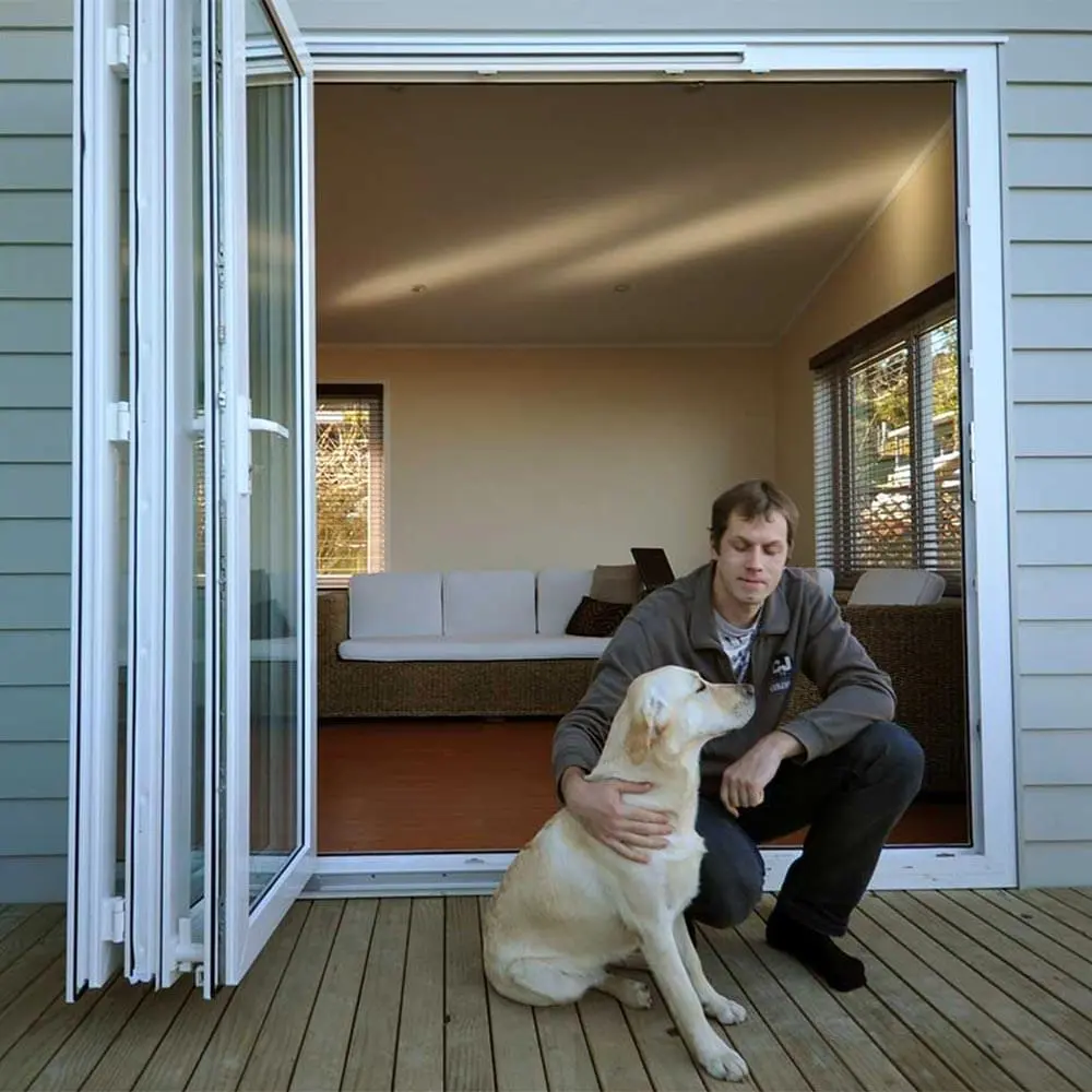 Man and dog outside bifold door