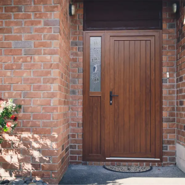 Wooden entrance door on brick home