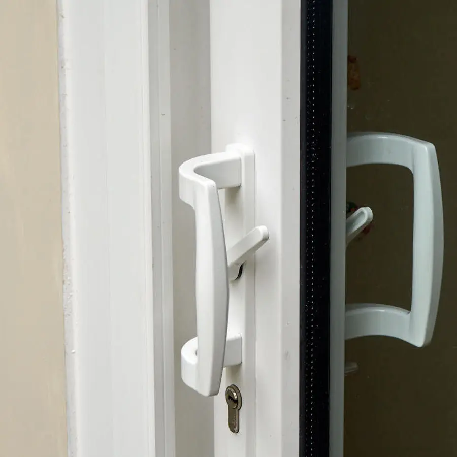 Close up of white upvc sliding door handle